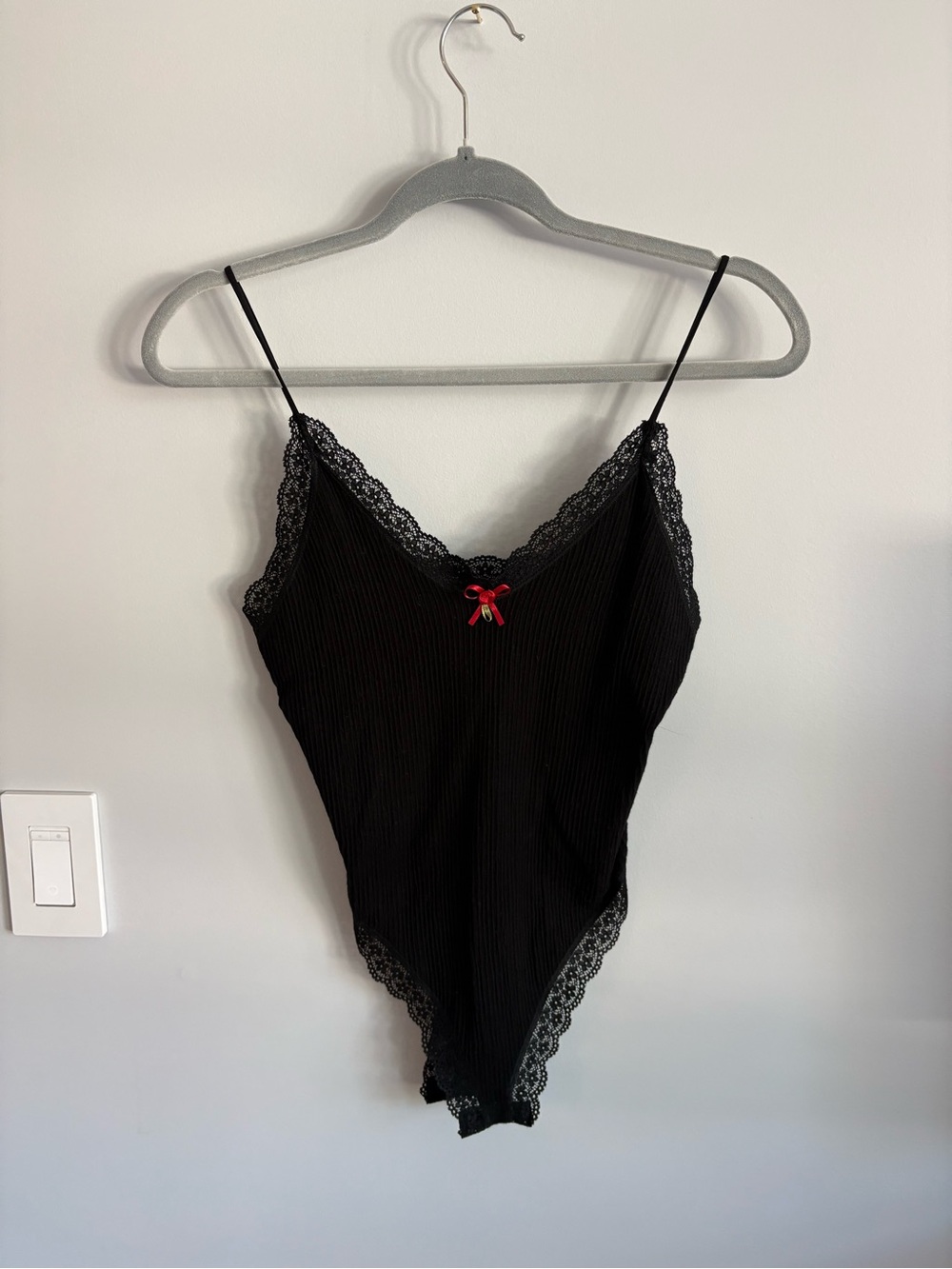 Black Ribbed Lace-Trim Bodysuit with Red Bow Accent